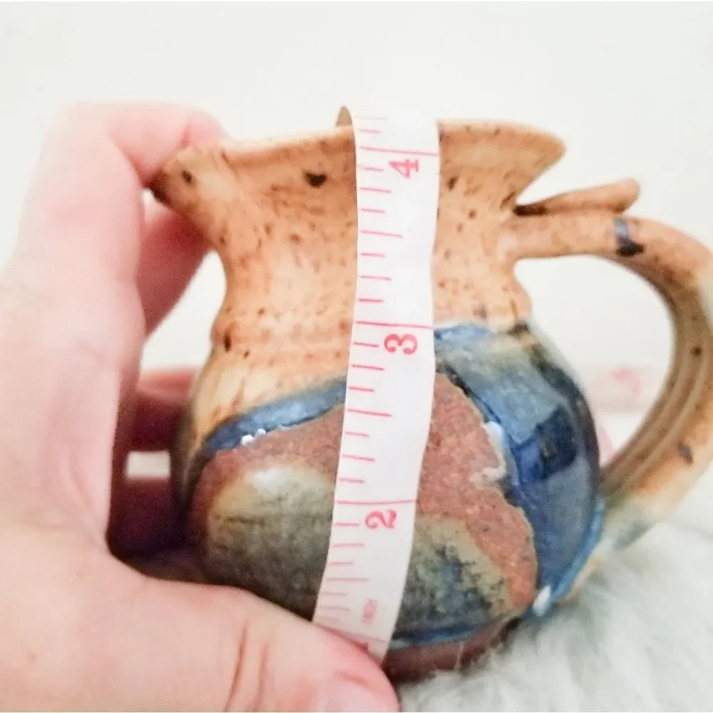 Pottery creamer signed by artist